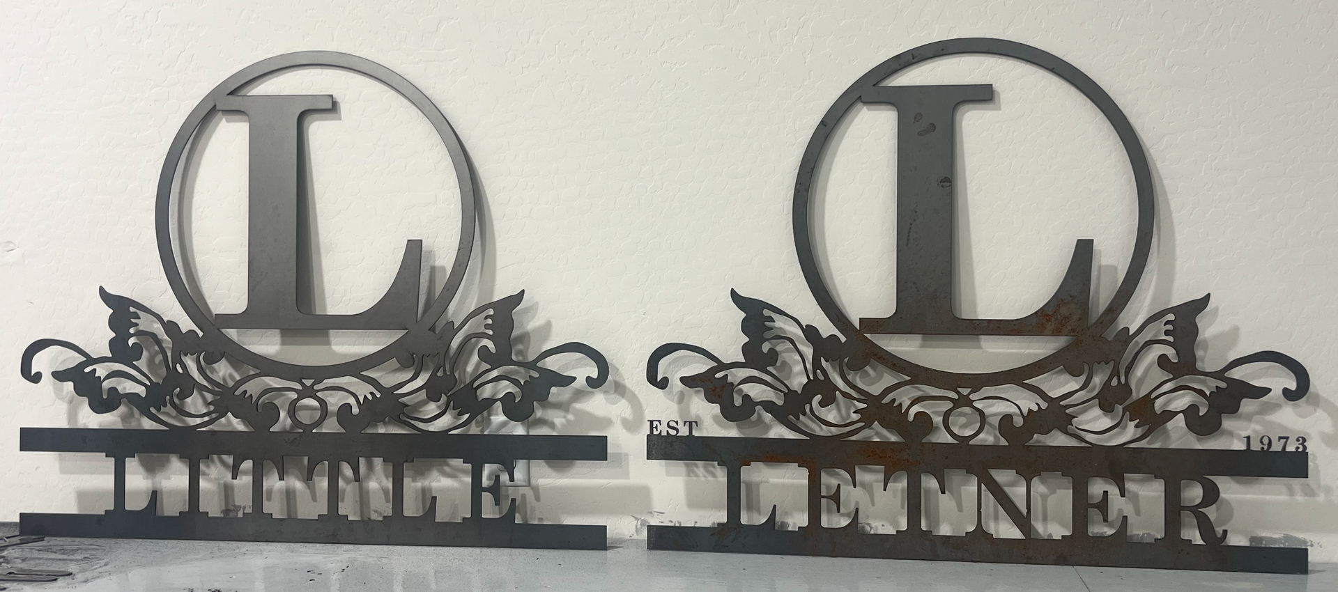 Pair of Letner family monogram signs
